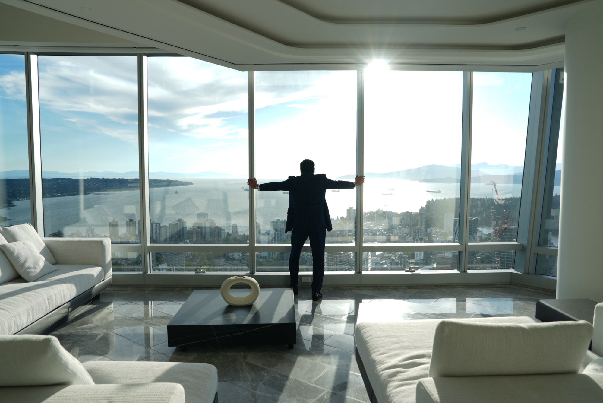 A founder at the glass, overlooking the harbour